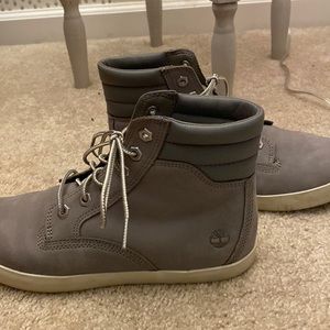 Grey Timberland high top sneakers.